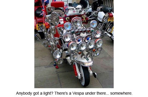 Anybody got a light? There's a Vespa under there... somewhere.